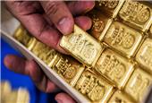 Gold eases on firm dollar, investors await clarity on trade spat
