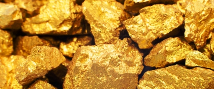 Gold hovers near $1,300 as investors await Fed meet, trade talks