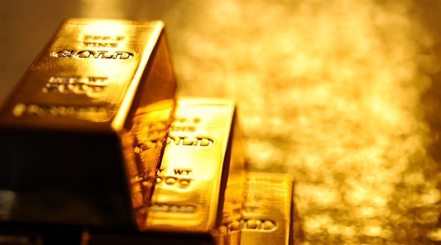 Gold price dips on dollar gains