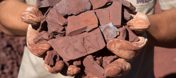 Surging iron ore drives Australia to trade surplus