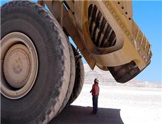 Mining giants warn of tougher times as world demand wavers