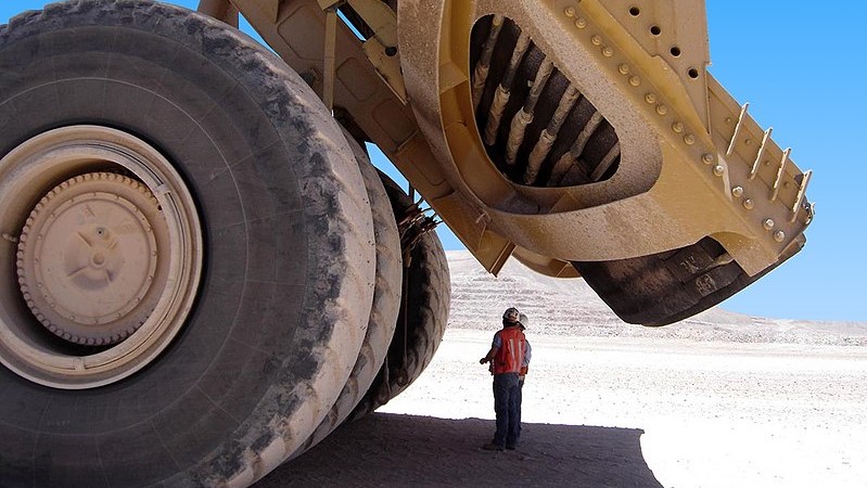 Mining giants warn of tougher times as world demand wavers